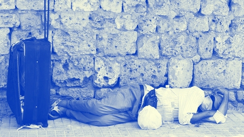 man sleeping on street