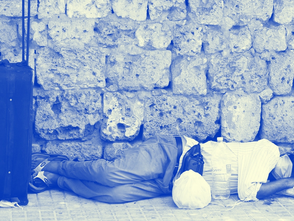 man sleeping on street