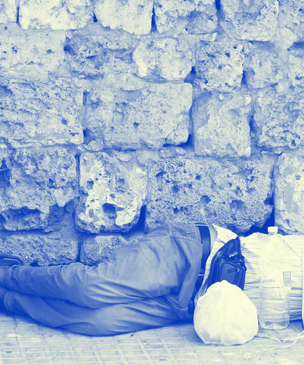 man sleeping on street