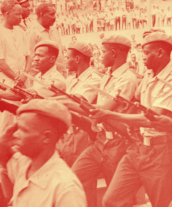 roops march before President Julius Nyerere and Vice President Abeid Karume at the fourth anniversary of the union of Zanzibar and Tanganyika in January 1968